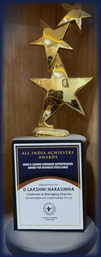 Trophy base plate reading All India Achievers Awards, India's Leading Emerging Entrepreneur Award for Business Excellence, presented to D Lakshmi Narasimha, Chairman and Managing Director, Technogreen Air Conditioning Pvt Ltd.