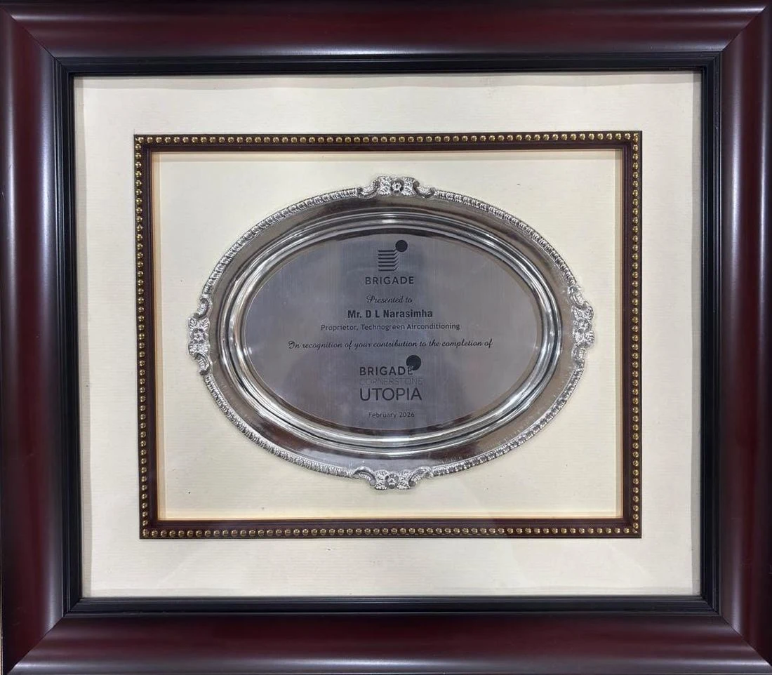 Framed silver oval salver engraved with the Brigade mark, presented to Mr. D L Narasimha, Proprietor, Technogreen Airconditioning, in recognition of your contribution to the completion of Brigade Cornerstone Utopia, February 2026.