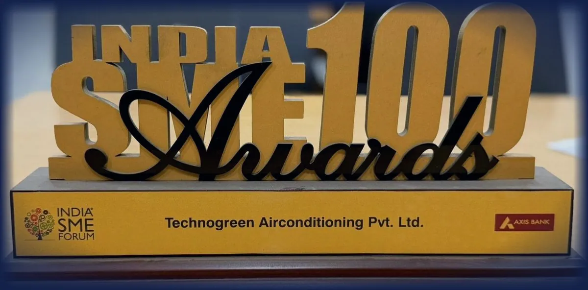 Trophy cut from the words India SME 100 Awards, standing on a plate lettered India SME Forum, Technogreen Airconditioning Pvt. Ltd., Axis Bank.