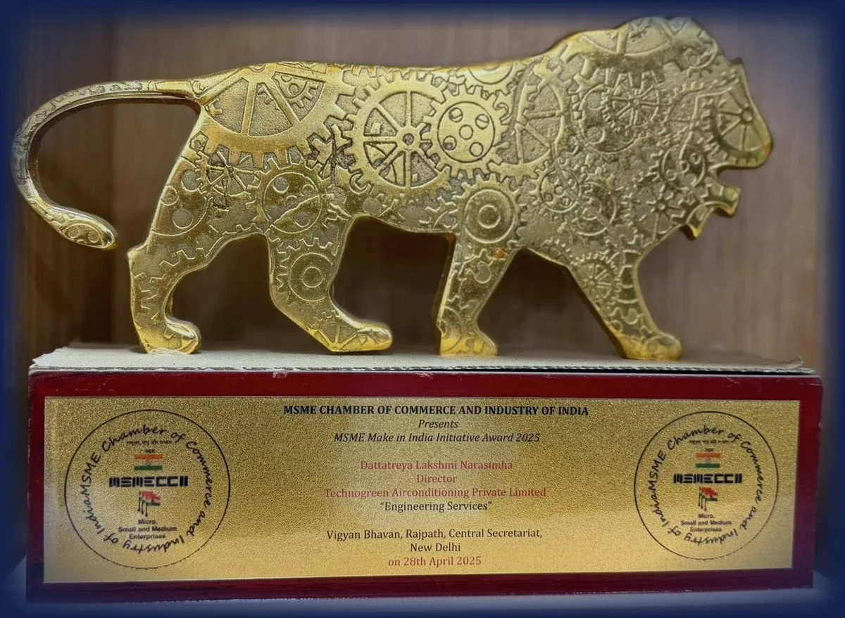 Gold lion trophy cast with gear wheels, on a plate reading MSME Chamber of Commerce and Industry of India presents MSME Make in India Initiative Award 2025 to Dattatreya Lakshmi Narasimha, Director, Technogreen Airconditioning Private Limited, Engineering Services, Vigyan Bhavan, Rajpath, Central Secretariat, New Delhi, on 28th April 2025.